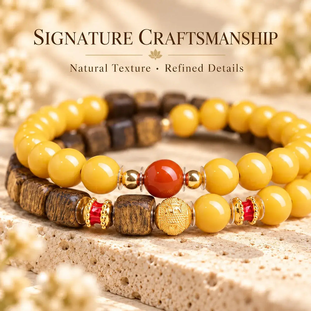Detail of yellow amber beads, brown agarwood and red accents