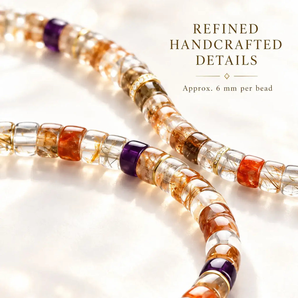 Close-up of clear crystal beads with dark and gold-colored inclusions