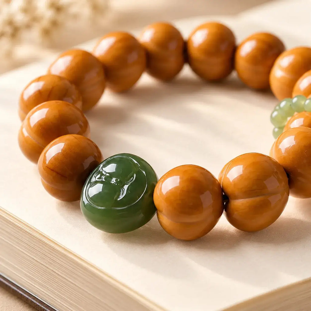 Houtou Walnut & Hetian Jade Peach Character Bracelet - close-up detail
