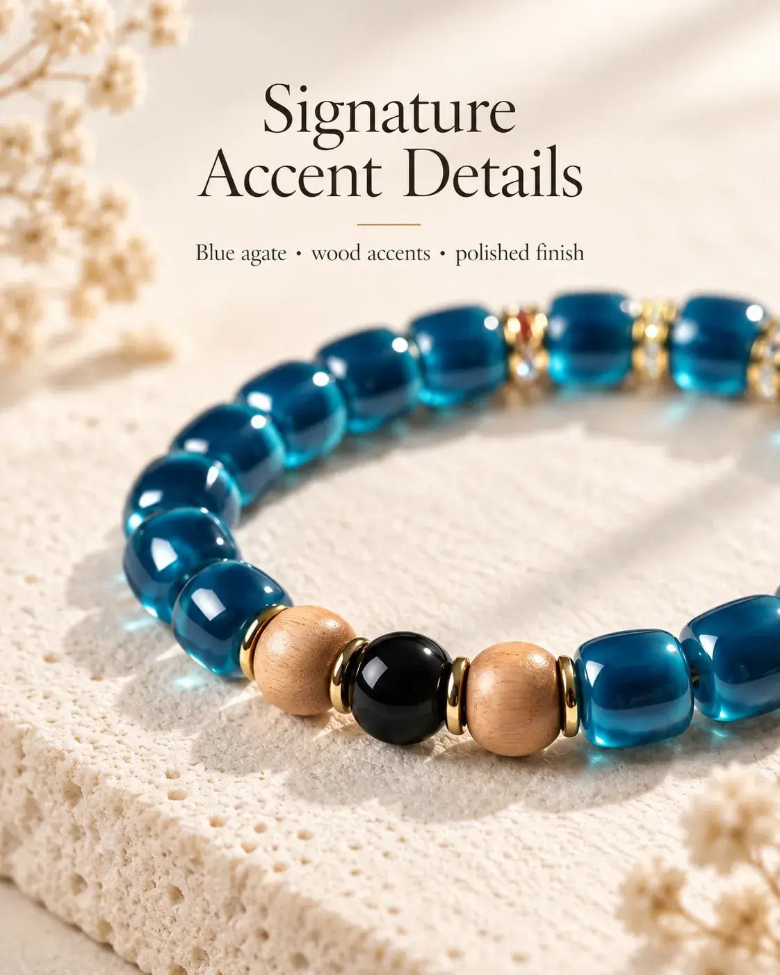 Detail of blue agate beads, two tan sandalwood accents and a glossy black centerpiece