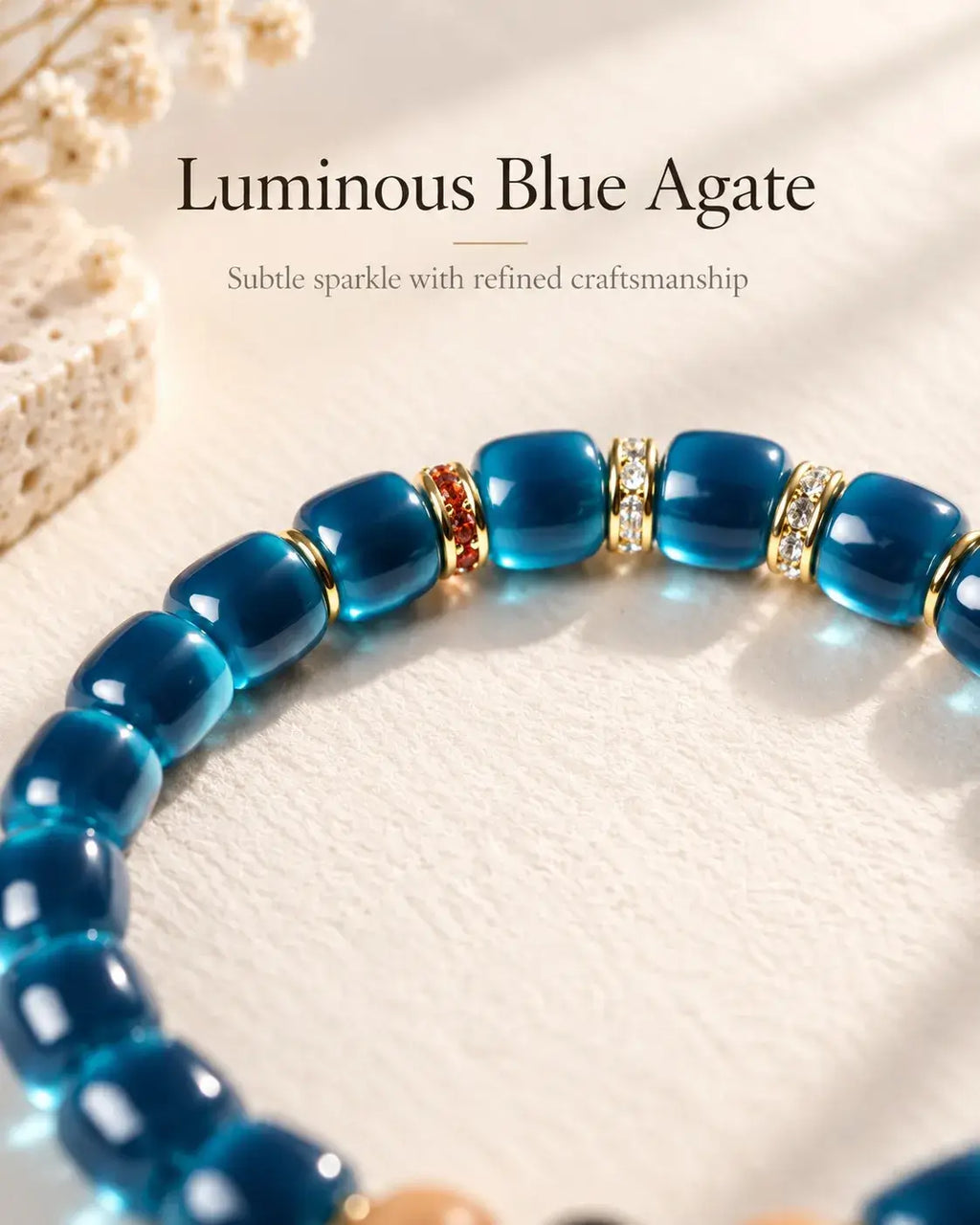 Close-up of polished 6 × 7 mm blue agate beads and gold-tone decorative spacers