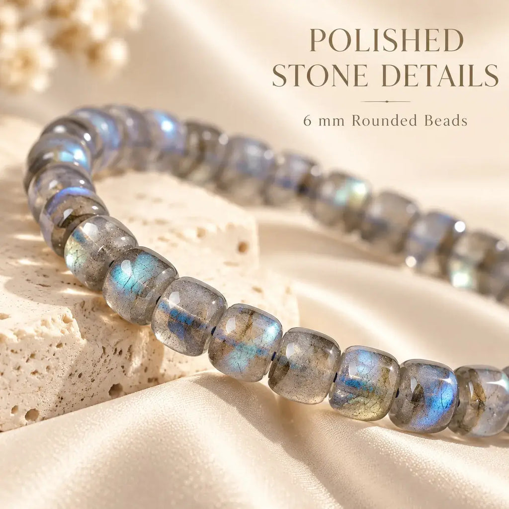 Polished rounded moonstone beads showing gray tones and blue sheen
