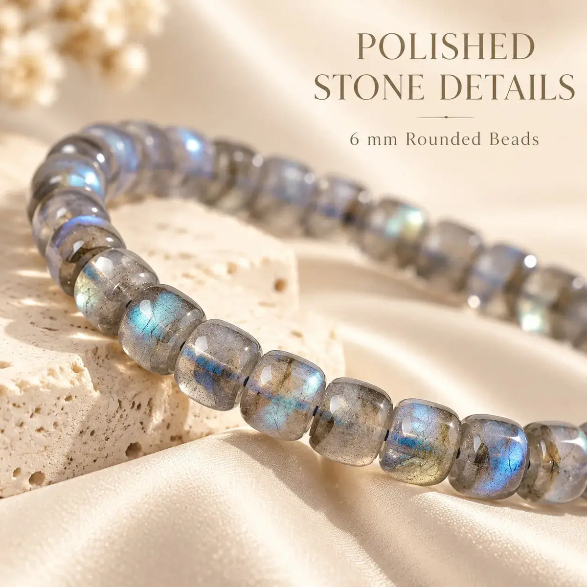 Polished rounded moonstone beads showing gray tones and blue sheen