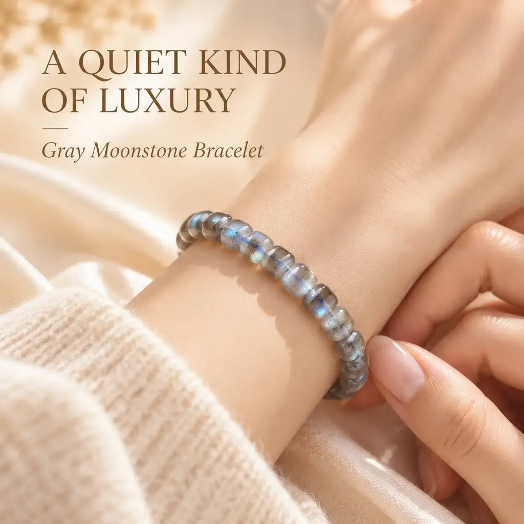 Natural gray moonstone bracelet with blue flashes worn on the wrist