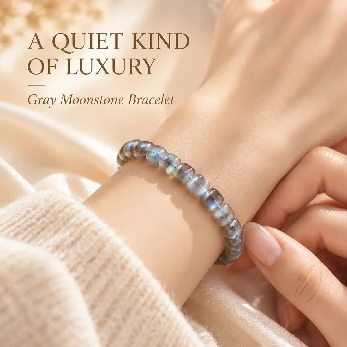 Natural gray moonstone bracelet with blue flashes worn on the wrist