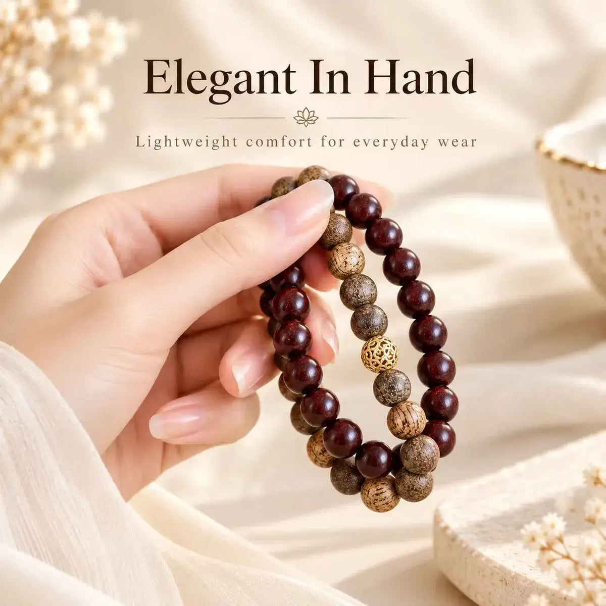 Hand-held view of the red sandalwood and agarwood double wrap bracelet