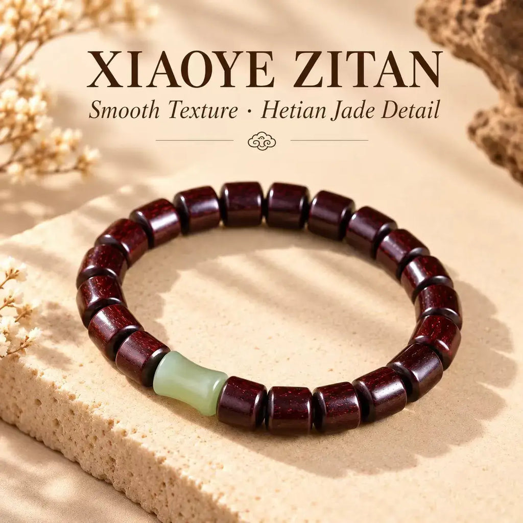 Full view of barrel-shaped red sandalwood beads and Hetian jade accent